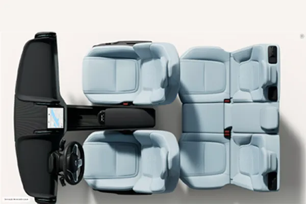 Vista superior do interior de um Volvo com bancos azul-claros e painel