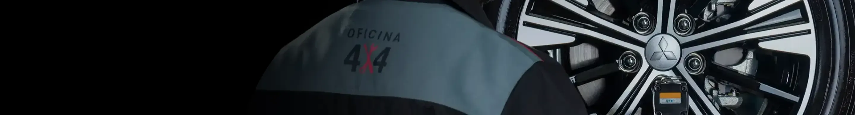 Mecânico mexendo em roda MITSUBISHI