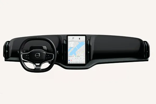 Painel de um Volvo com volante e tela central de navegação, em fundo branco